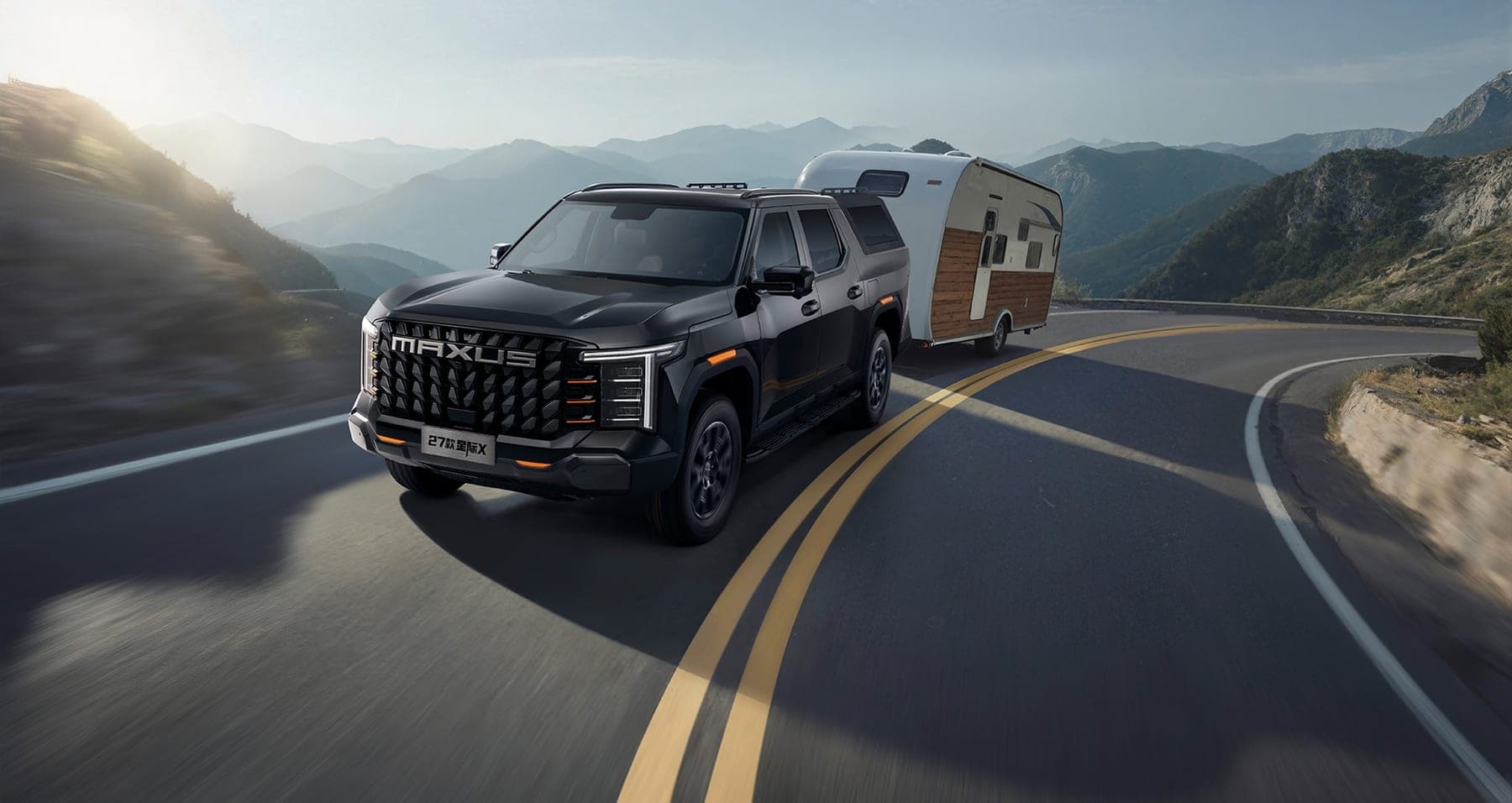 2027 MAXUS Interstellar X Passenger Edition — Double Cab Pickup Truck with Integrated Hardtop Canopy for export, towing a caravan on a mountain road