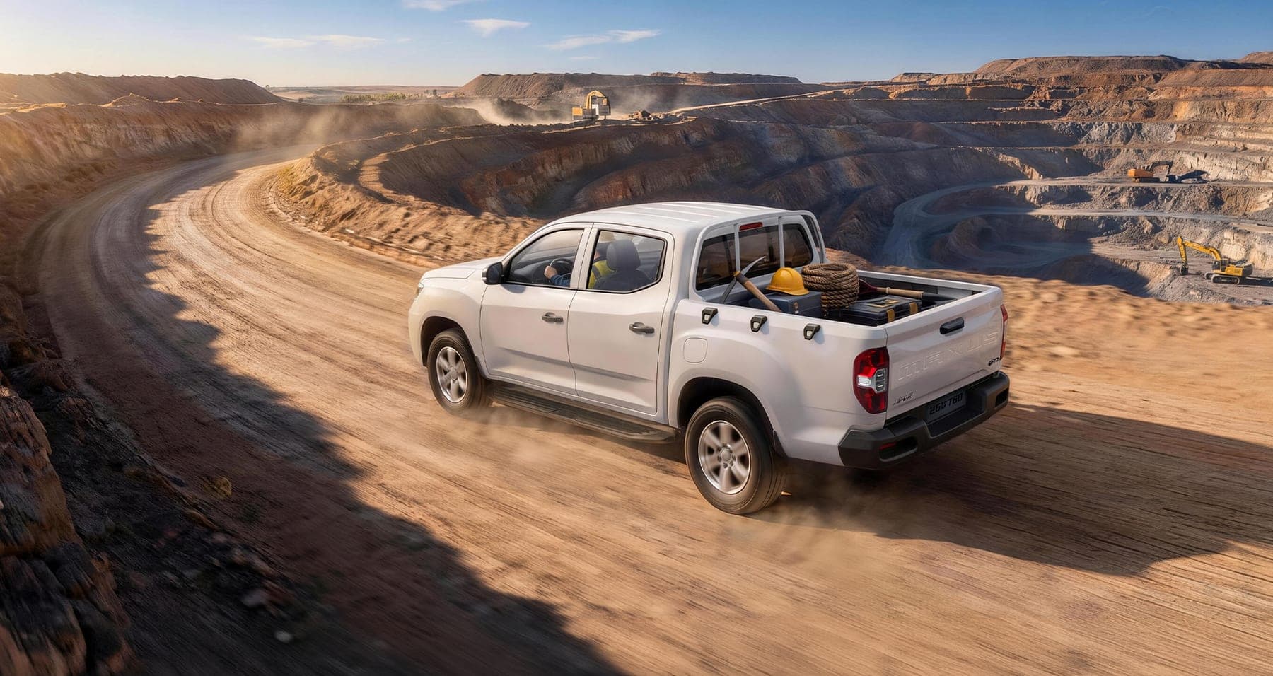 2026 MAXUS T60 — Double Cab Pickup Truck for export, rear three-quarter view on a mine haul road